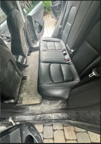 Rear leather seats and muddy floor before detailing